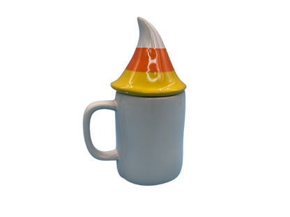 Side view of lidded Rae Dunn corn mug showing handle